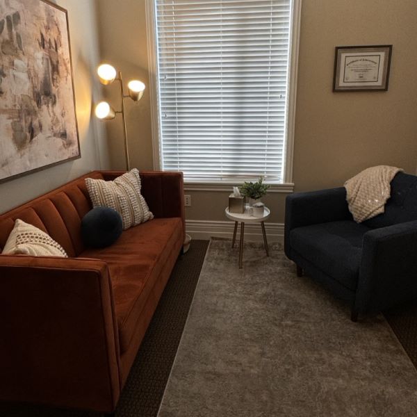 Rust-Couch-Blue-Lounge-Chair-in-Draper-Office-Rooted-Counseling-Wellness